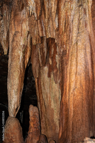 This cave wall appears to have a bronze coloration and is quite pretty. Nice texture or background. Bokeh effect.