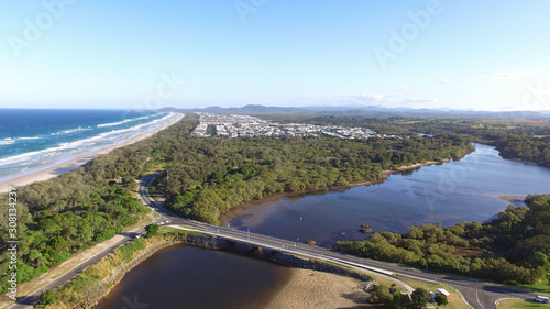 Cudgen Creek Bridge Kingscliff New South Wales Australia with Casurina Beach in background © vekidd