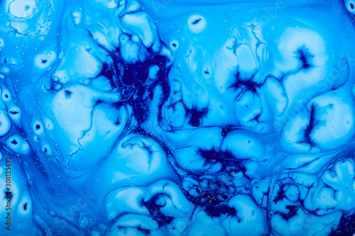 Color paint drops in water. Ink swirling underwater.