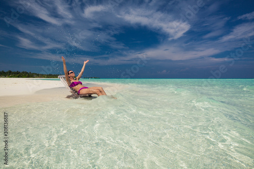 Fototapeta Naklejka Na Ścianę i Meble -  Young gorgeous woman in bikini on a tropical island