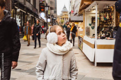 Photography A cute little girl on christmas market in Budapest, Hungary