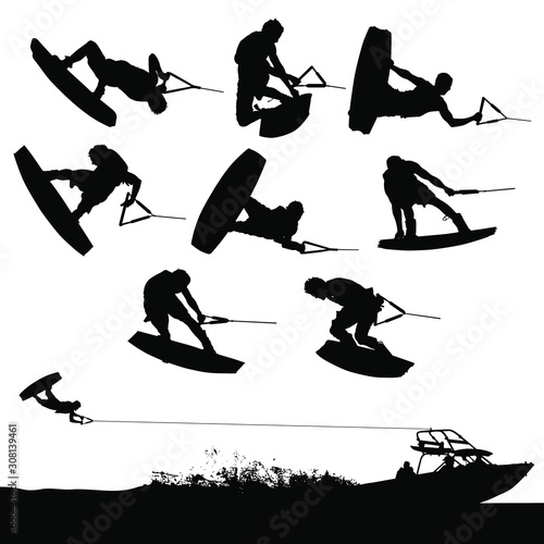 Vector wakeboarding silhouettes of in-air action and a boat pulling a wakeboarder. photo