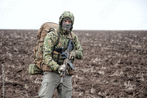 Portrait of modern army infantryman on march