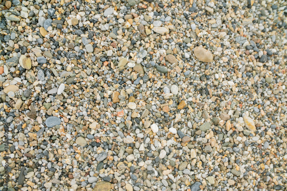 background surface of sea pebbles, stones and sand background surface of sea pebbles, stones and sand