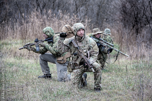 Military army soldiers tactical teamwork in forest