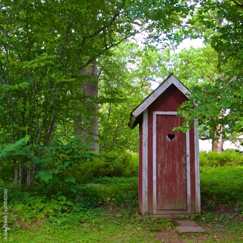 Картината върху платно Red outhouse in the countryside of Unguri in Lithuania