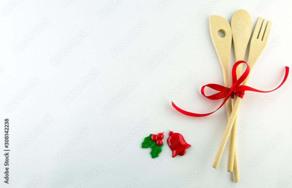 Kitchen accessories on a white background with red decorative ribbon. Kitchen accessories on a white background with red decorative ribbon.
