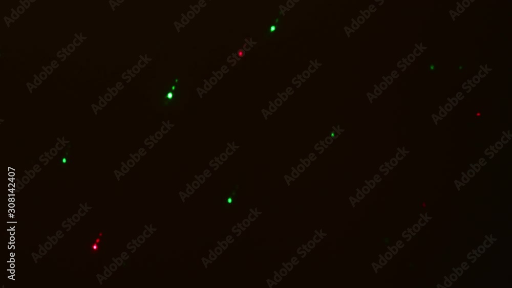 Beautiful colorful background / texture. Flashing and moving green and red lights. Party, holidays background. Beautiful colorful background / texture. Flashing and moving green and red lights. Party, holidays background.