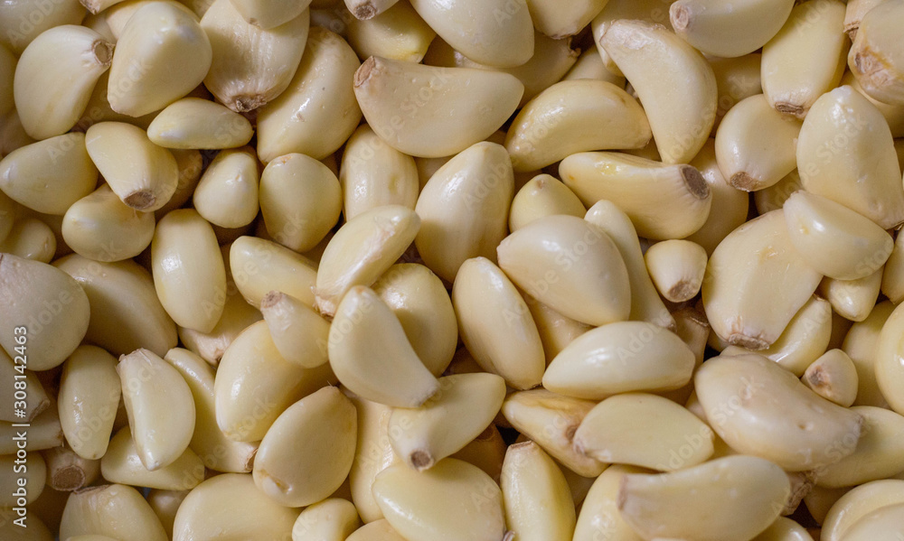 Lots of garlic, background, vegan and vegetarian food, healthy food Lots of garlic, background, vegan and vegetarian food, healthy food