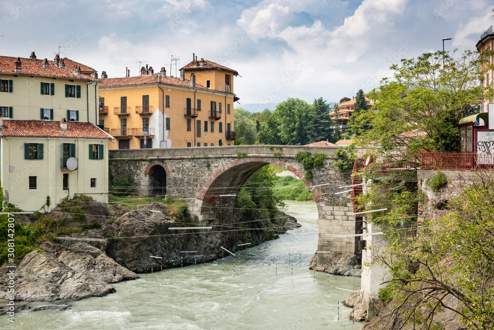 old bridge over the Dora Baltea river in Ivrea city, Torino, region Piemonte, Italy