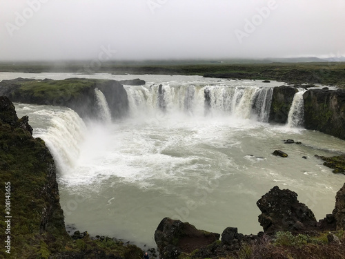 View of a large waterfall on a cloudy day