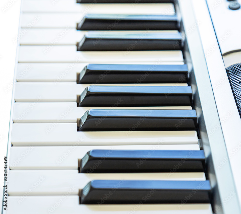 Close up black and white part of electronic keyboard synthesizer selective shallow depth of field Close up black and white part of electronic keyboard synthesizer selective shallow depth of field