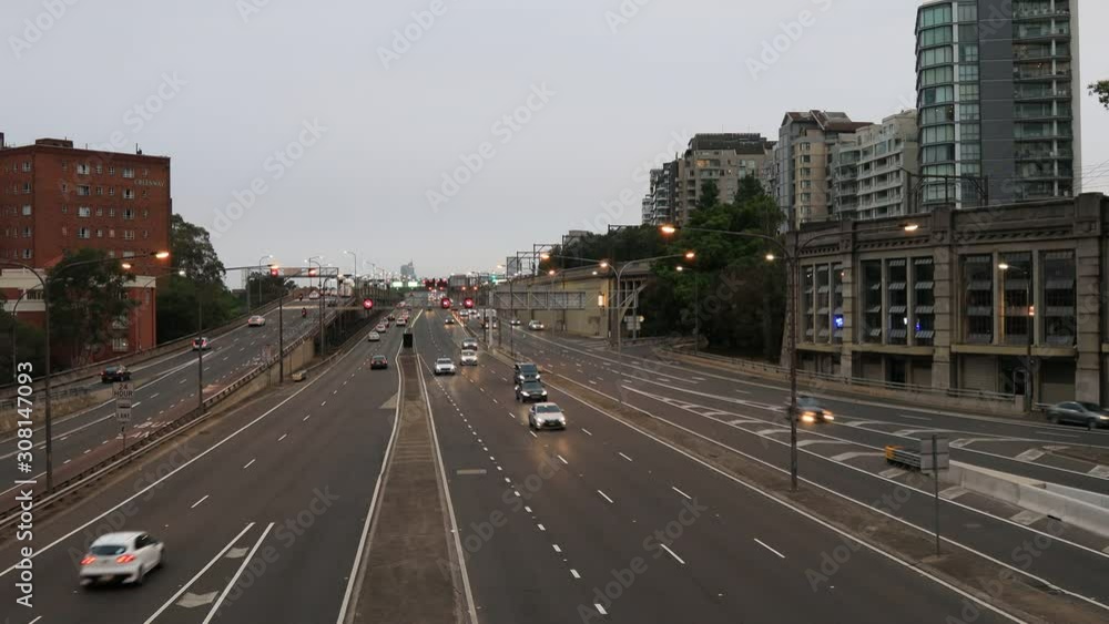Warringah freeway leading to the Sydney Harbour bridge from North Sydney at sunset with motor vehicle traffic in both directions. Warringah freeway leading to the Sydney Harbour bridge from North Sydney at sunset with motor vehicle traffic in both directions.