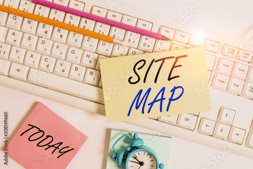 Text sign showing Site Map. Business photo showcasing designed to help both users and search engines navigate the site Flat lay above empty note paper on the pc keyboard pencils and clock