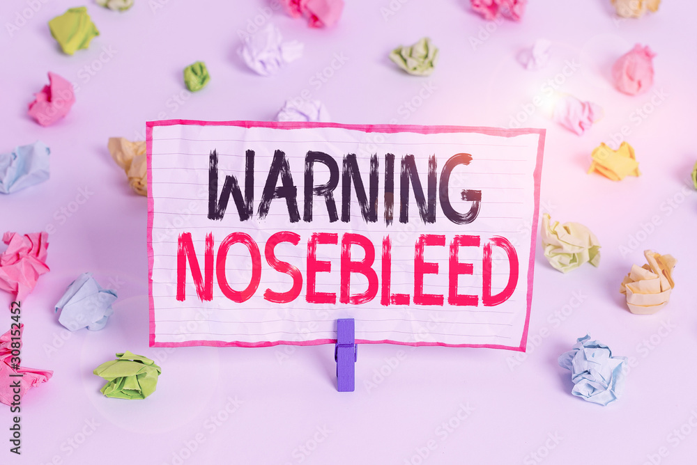 Handwriting text writing Warning Nosebleed. Conceptual photo caution on bleeding from the blood vessels in the nose Colored crumpled papers empty reminder white floor background clothespin Handwriting text writing Warning Nosebleed. Conceptual photo caution on bleeding from the blood vessels in the nose Colored crumpled papers empty reminder white floor background clothespin