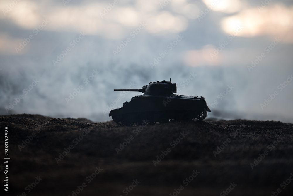 Fototapeta premium War Concept. Military silhouettes fighting scene on war fog sky background, World War German Tanks Silhouettes Below Cloudy Skyline At night. Attack scene.