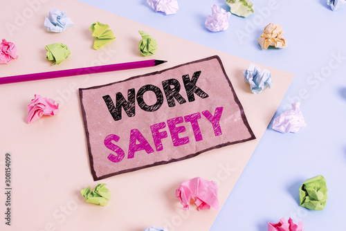 Handwriting text writing Work Safety. Conceptual photo policies and procedures in place to ensure safety in workplace Colored crumpled papers empty reminder blue yellow background clothespin
