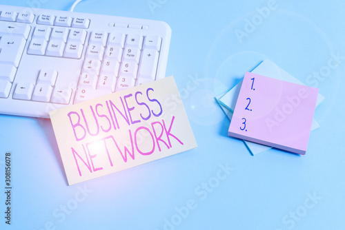 Text sign showing Business Network. Business photo text Interfirm cooperation that allows companies to collaborate Paper blue desk computer keyboard office study notebook chart numbers memo