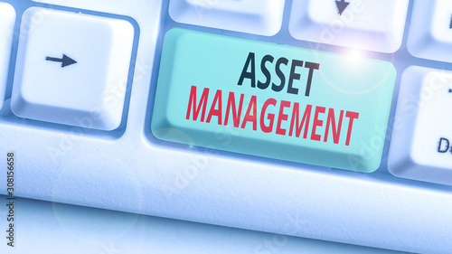 Writing note showing Asset Management. Business concept for analysisaged investment of assets of a demonstrating or business photo