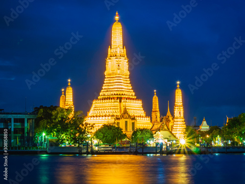 Night view of Wat Arun Ratchawararam temple. Beautiful sunset at Chao Phraya river, landmark thailand tourist spot, Bangkok, Thailand