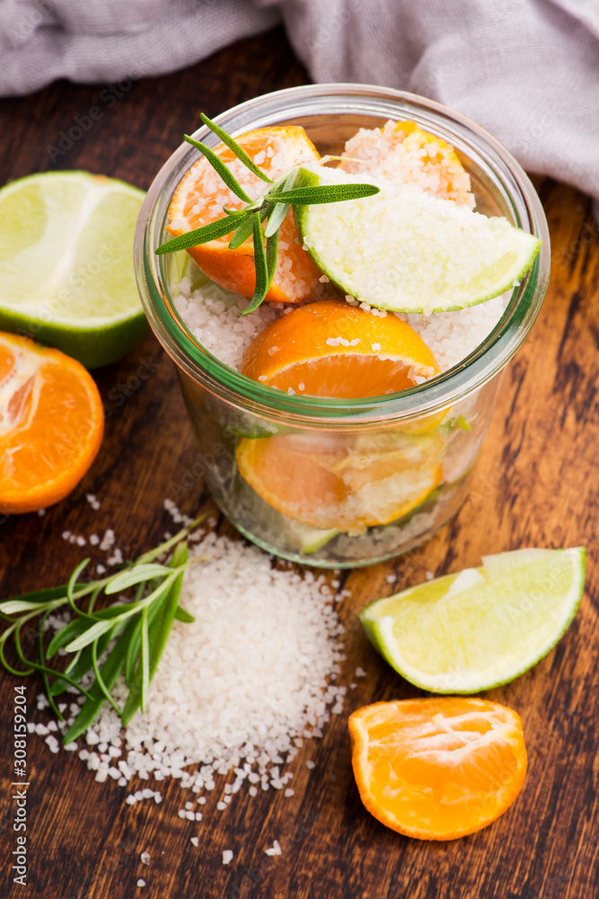Preserved Lime and Mandarin with salt on a wooden board