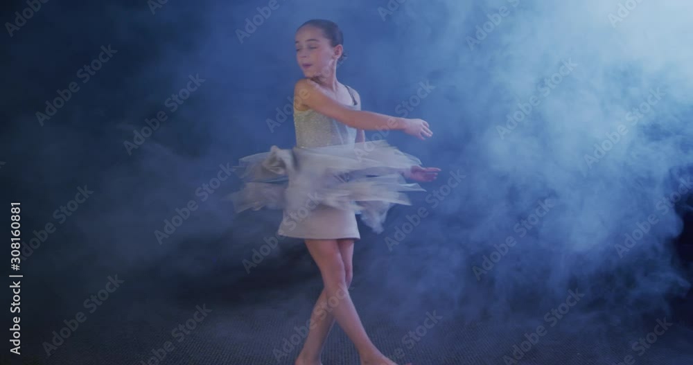 Ballerina doing pirouettes, child dancer spinning slow motion Ballerina doing pirouettes, child dancer spinning slow motion