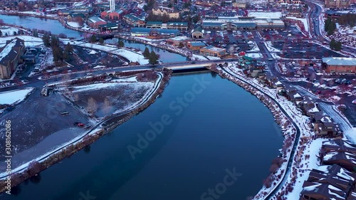 Establishing shot of Bend Oregon in winter with snow. Drone reveal forward. photo