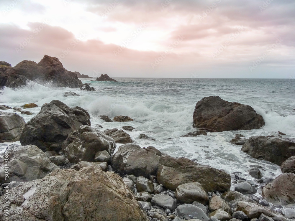 Bad cloudy stormy wet weather at a rugged rocky coastline Bad cloudy stormy wet weather at a rugged rocky coastline