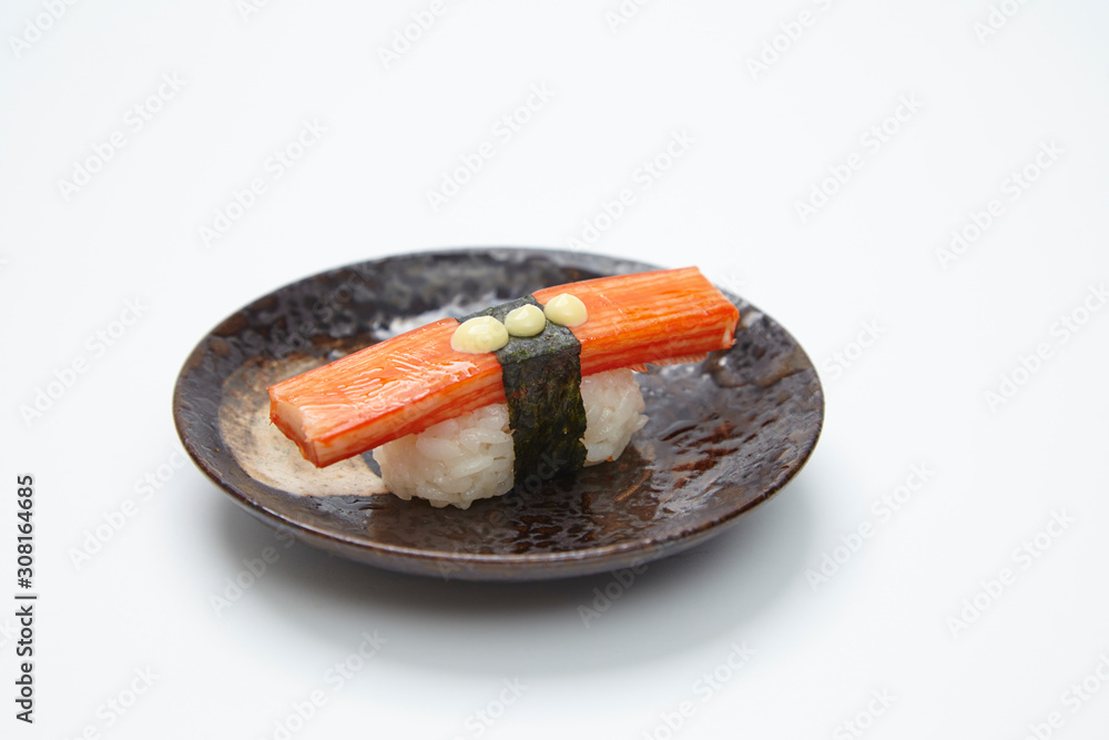 single served nigiri sushi made of kani kama isolated on white background single served nigiri sushi made of kani kama isolated on white background
