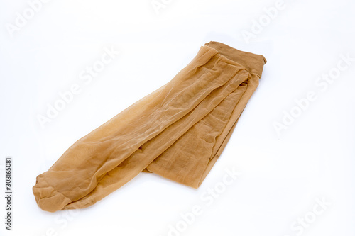 Women's nylon tights comfortable pantyhose beige tan color lingerie tights on isolated white background.