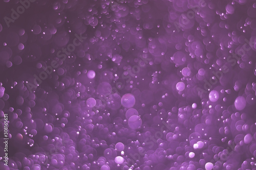 Abstract bokeh lights with light purple background