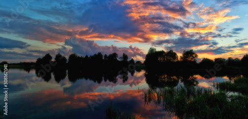Colored sunset sky reflected in the lake
