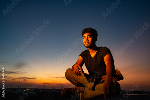 Man got high on rooftop in beautiful sky