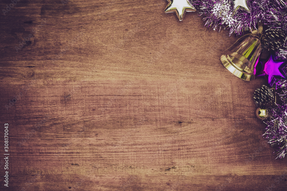 Purple christmas decorations on wooden background. Flat lay with copy space.