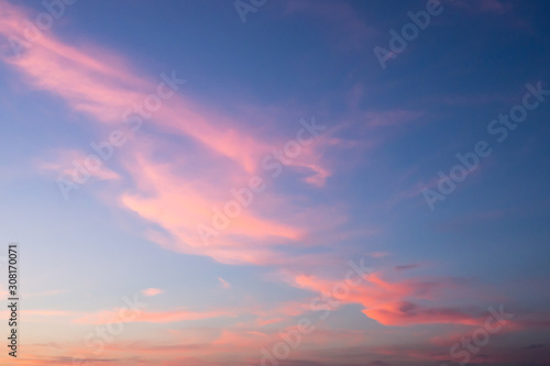 Blue sky and pink clouds. Sunset on a summer evening.