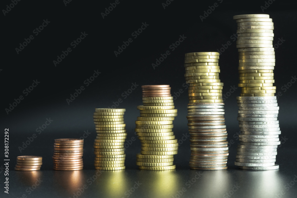 Ladder pile of money or coins suggesting business growth Ladder pile of money or coins suggesting business growth