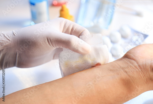 Wallpaper Mural Doctor hand bandage wound for healing from accident  Torontodigital.ca