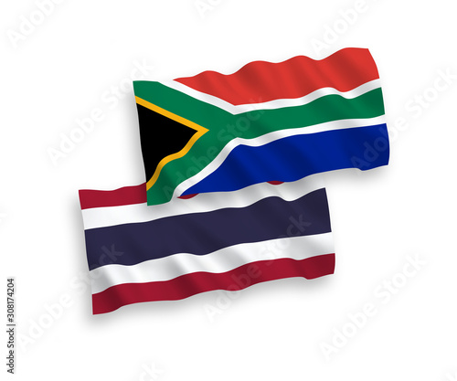 National vector fabric wave flags of Thailand and Republic of South Africa isolated on white background. 1 to 2 proportion.