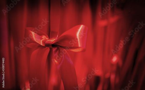 red fabrice ribbon decoration on red background copy space photo