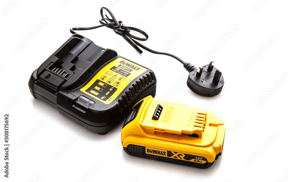 DeWalt DCB113 cordless power tool battery charger and battery on a white  background Stock Photo | Adobe Stock