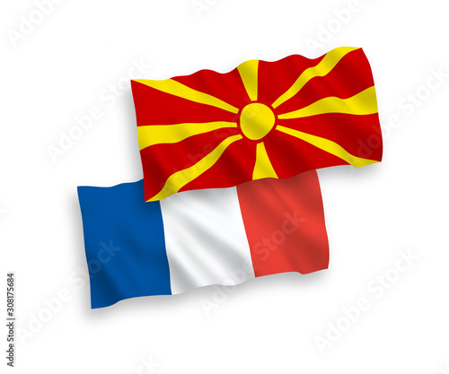 National vector fabric wave flags of France and North Macedonia isolated on white background. 1 to 2 proportion.