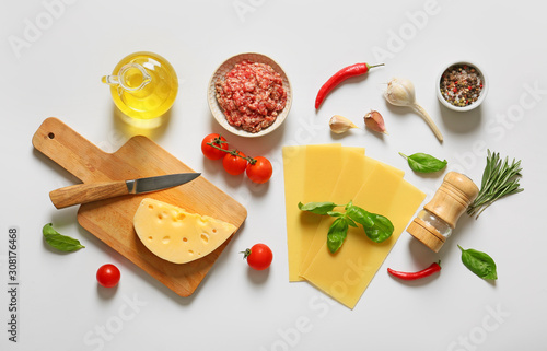 Ingredients for lasagna on white background