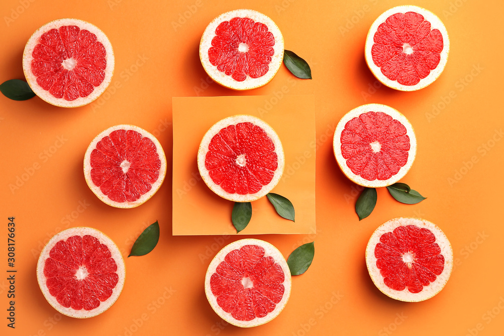 Fresh cut grapefruit on color background