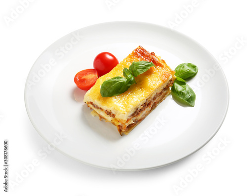 Plate with tasty baked lasagna on white background