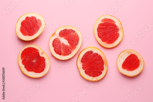 Fresh cut grapefruit on color background