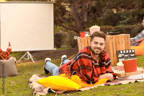 Happy young man in outdoor ...