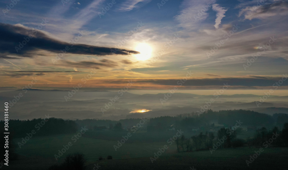 Fototapeta premium Sunrise in winter at the fog sea over the Silbersee