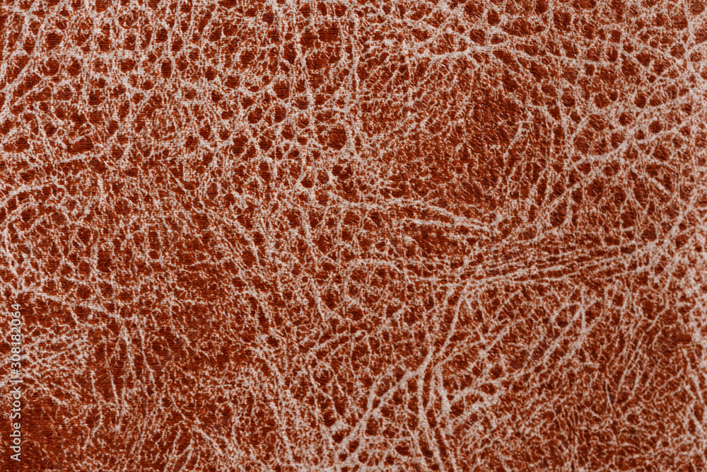 Brown natural leather texture with a pattern. Real animal skin background texture. Brown natural leather texture with a pattern. Real animal skin background texture.