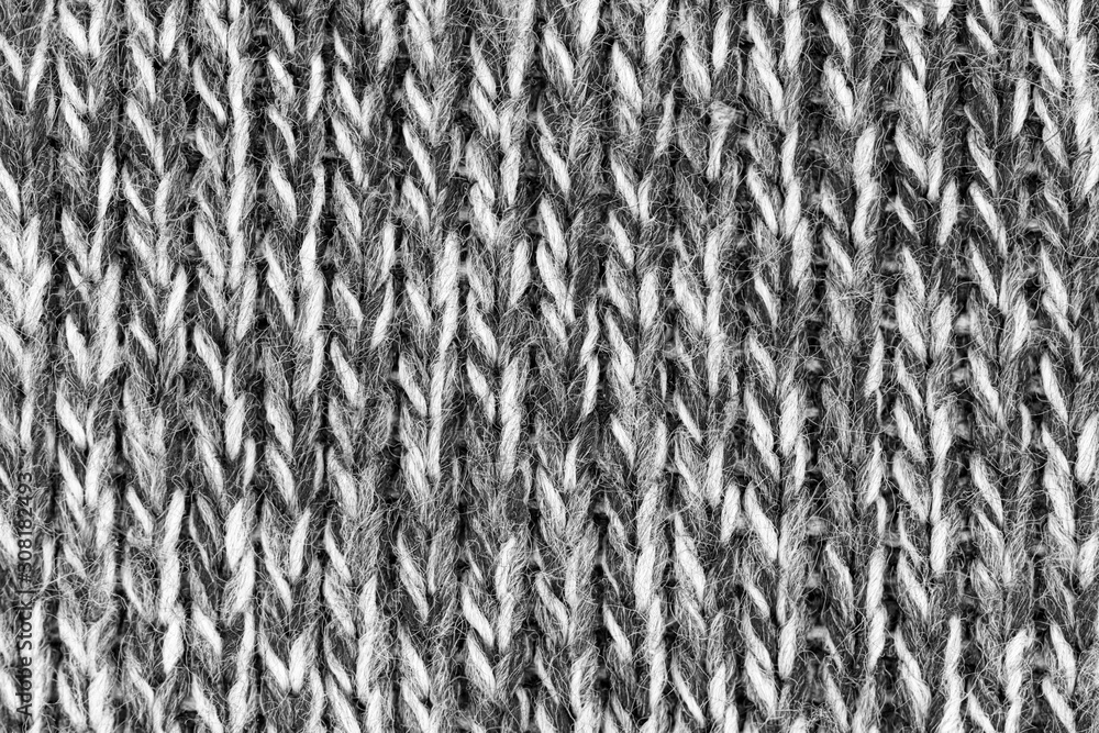 White natural texture of knitted wool textile material background. White cotton fabric woven canvas texture White natural texture of knitted wool textile material background. White cotton fabric woven canvas texture