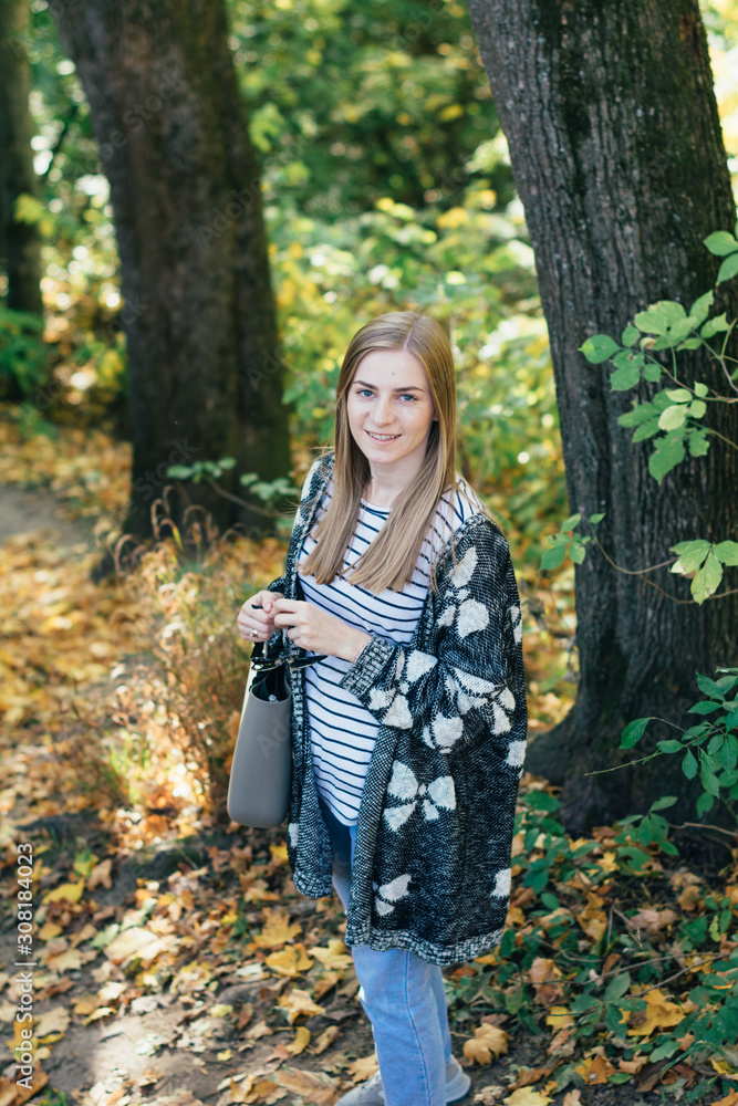 Portrait of young beautiful happy woman, autumn outdoors Portrait of young beautiful happy woman, autumn outdoors